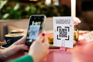Woman using AI interface to customize her meal in a smart restaurant