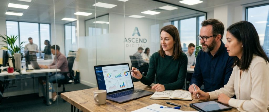 SEO specialists analyzing keyword rankings and search traffic analytics on a laptop screen in an office.